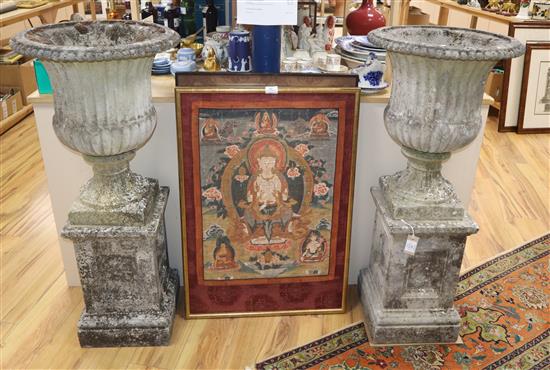 A pair of campana style urns on pedestals H.107cm